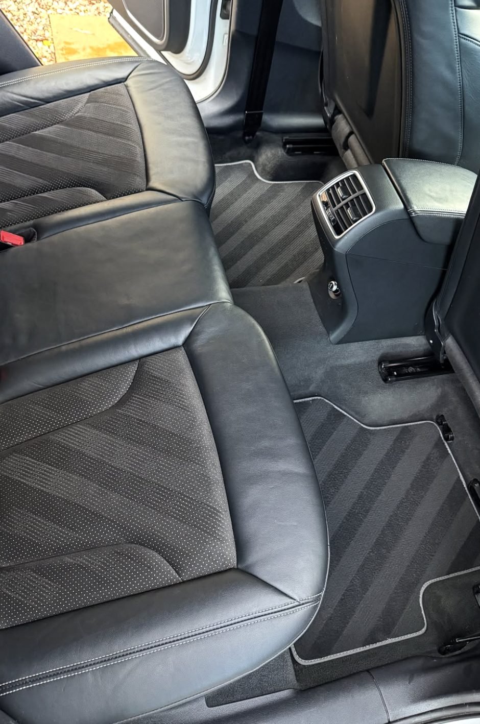 Deep cleaned car interior with spotless seats and carpets